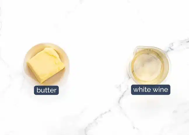 Quick butter sauce being made in the same pan from chicken drippings and white wine